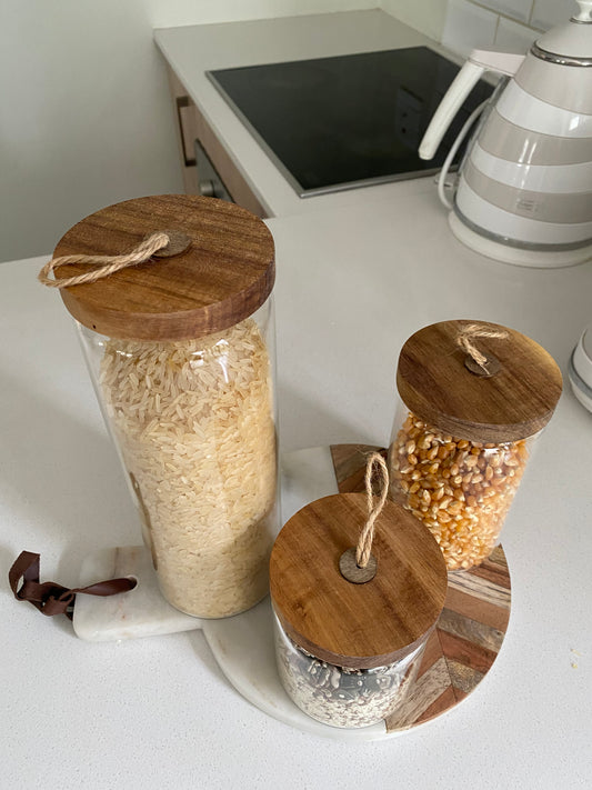 Glass storage jar with wood lid