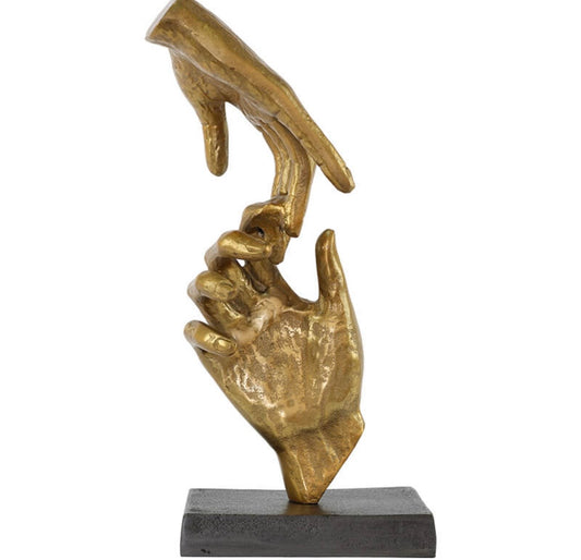 CM Gold hand sculpture